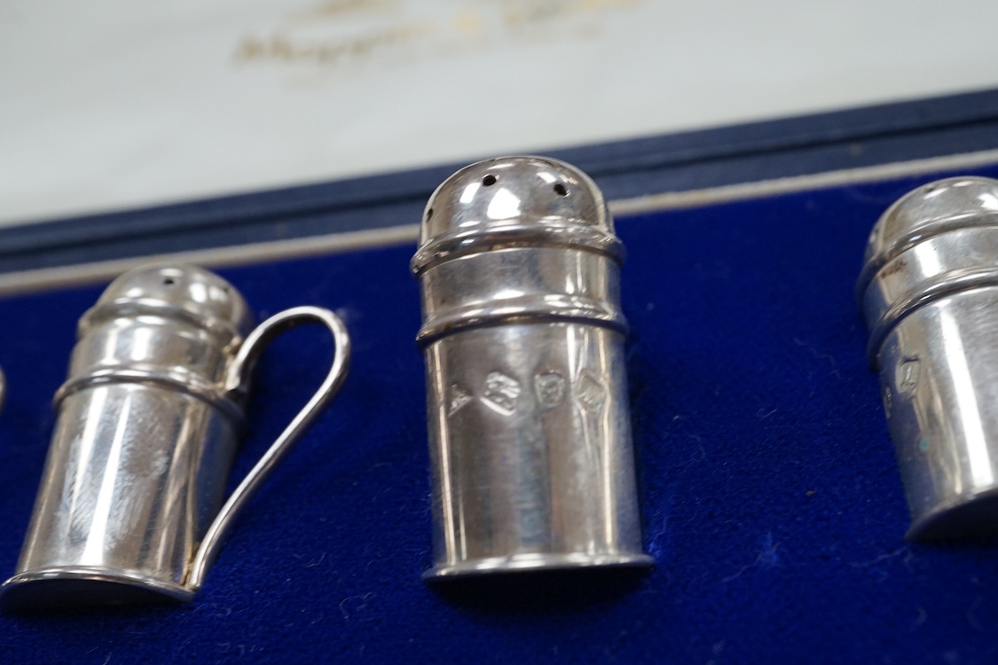 A modern cased set of twelve Mappin & Webb silver single handled condiments, J A Campbell London, 1986, 30mm.